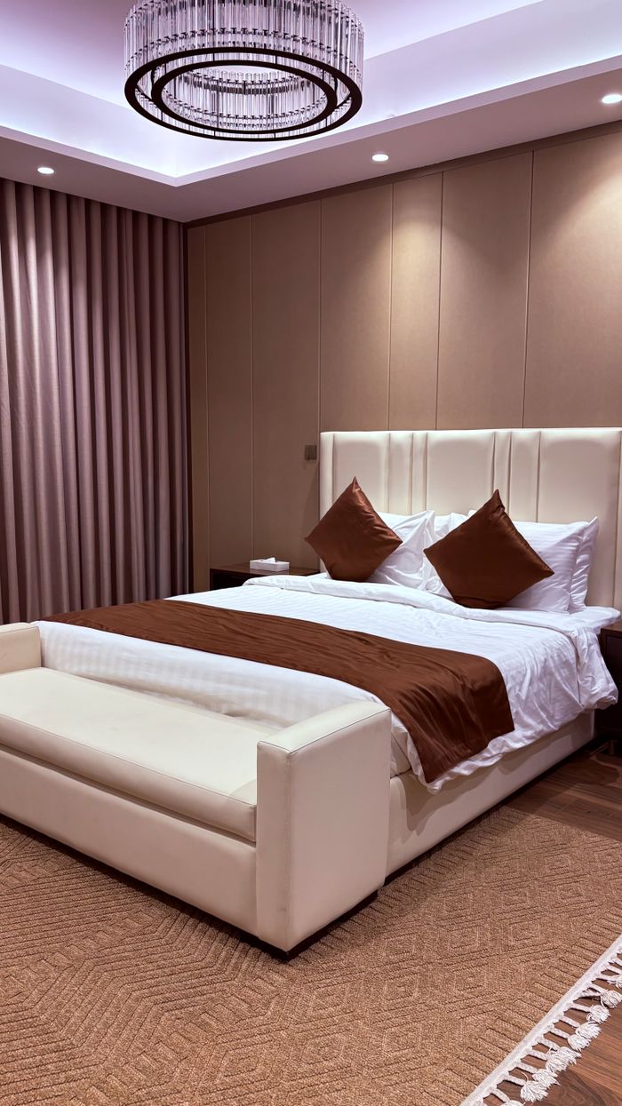 Sophisticated bedroom interior featuring elegant design and ambient lighting.